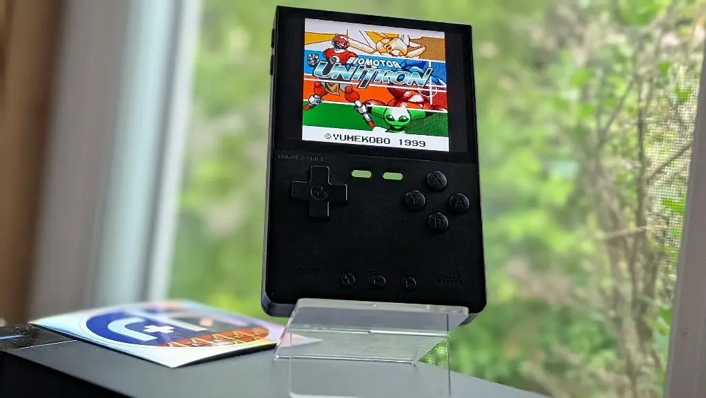 TrimUI Brick handheld displaying Neo Geo Pocket Color game at 5x scale