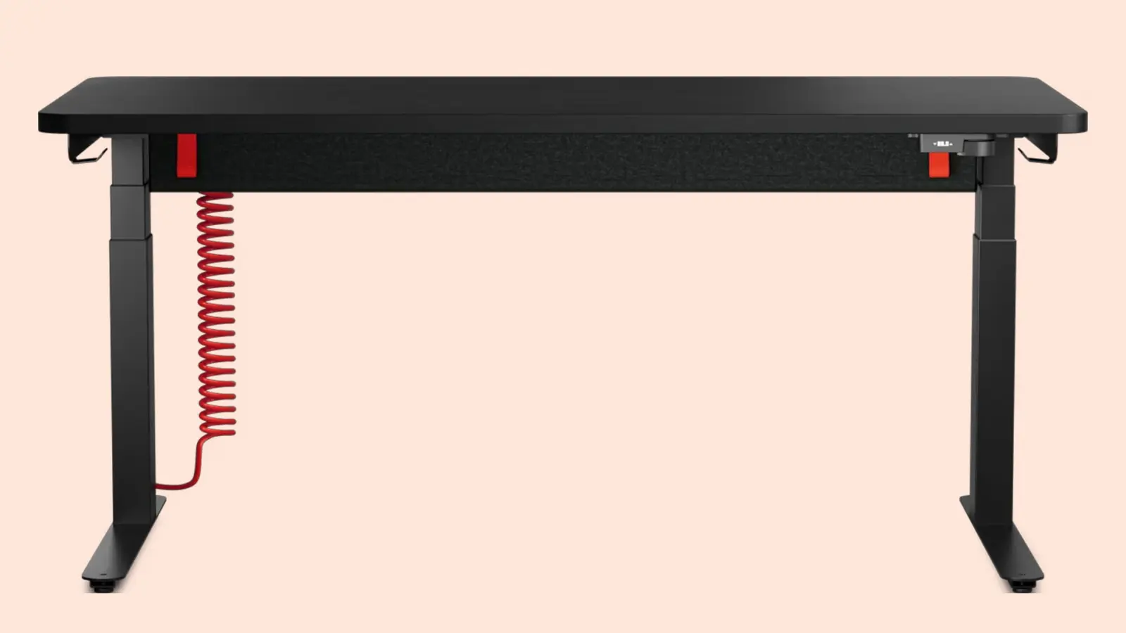 Herman Miller Coyl gaming desk with coiled red power cable and sit-stand legs