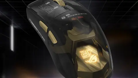 ASUS ROG Harpe II Extreme Edition 20 gaming mouse with gold accents and Gorilla Glass feet