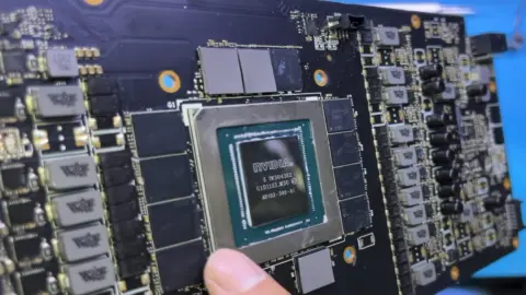 Disassembled ASUS GeForce RTX 4090 graphics card showing internal components
