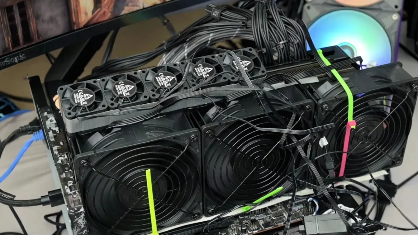 RTX 3080 graphics card surrounded by multiple fans and liquid cooling components
