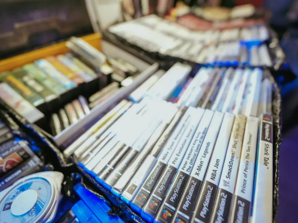 Retail display showing digital download code cards replacing physical game cases