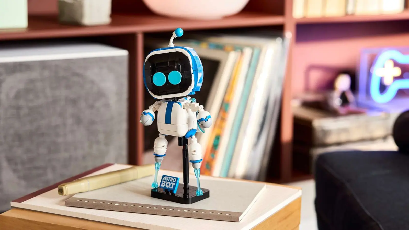 Assembled Lego Astro Bot figure on display stand